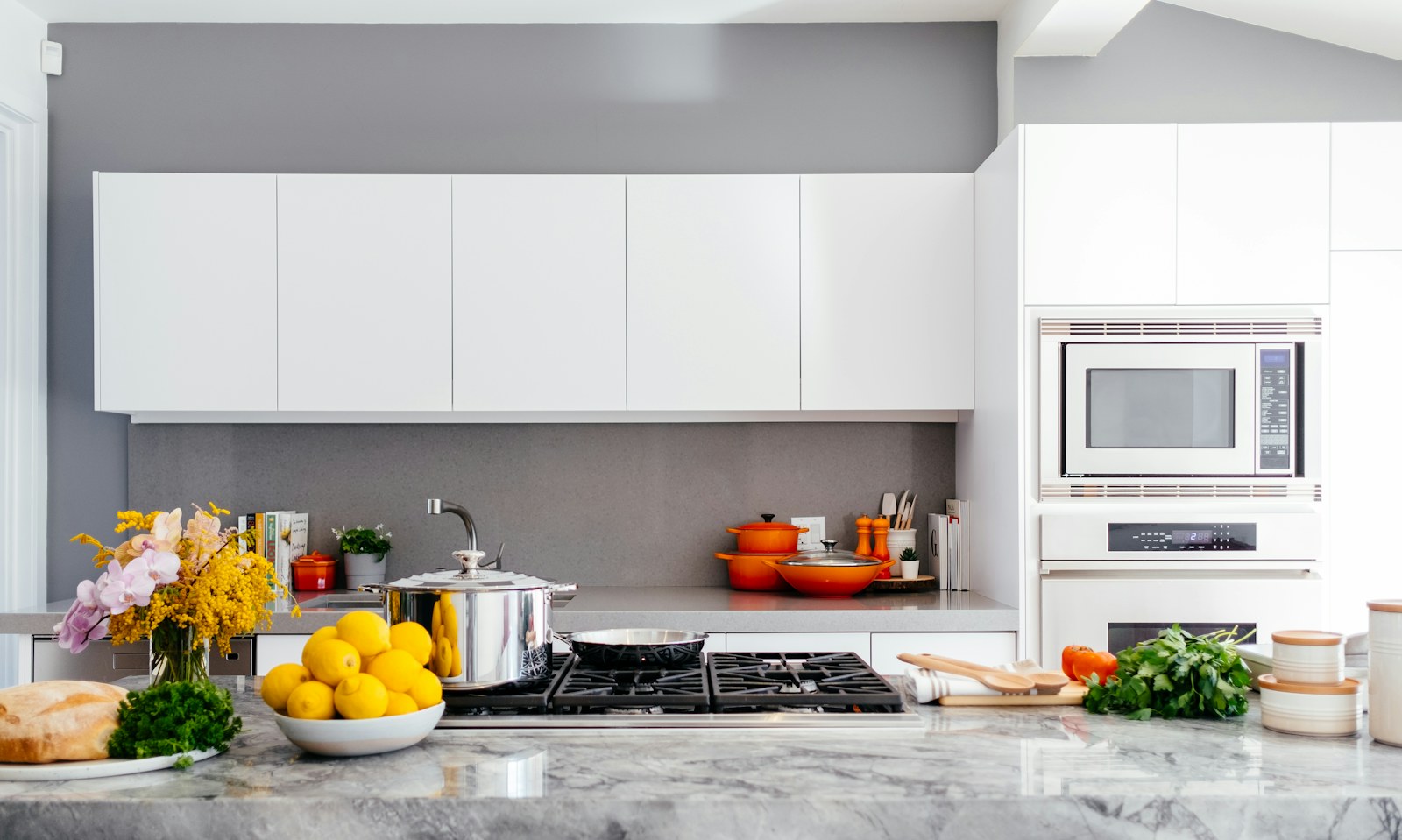 A home cook preparing vegetables in a bright compact kitchen