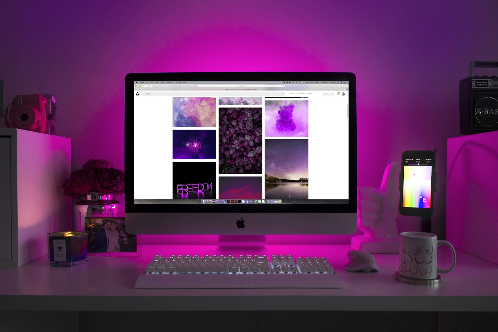 A home office desk with a monitor and comfortable working setup