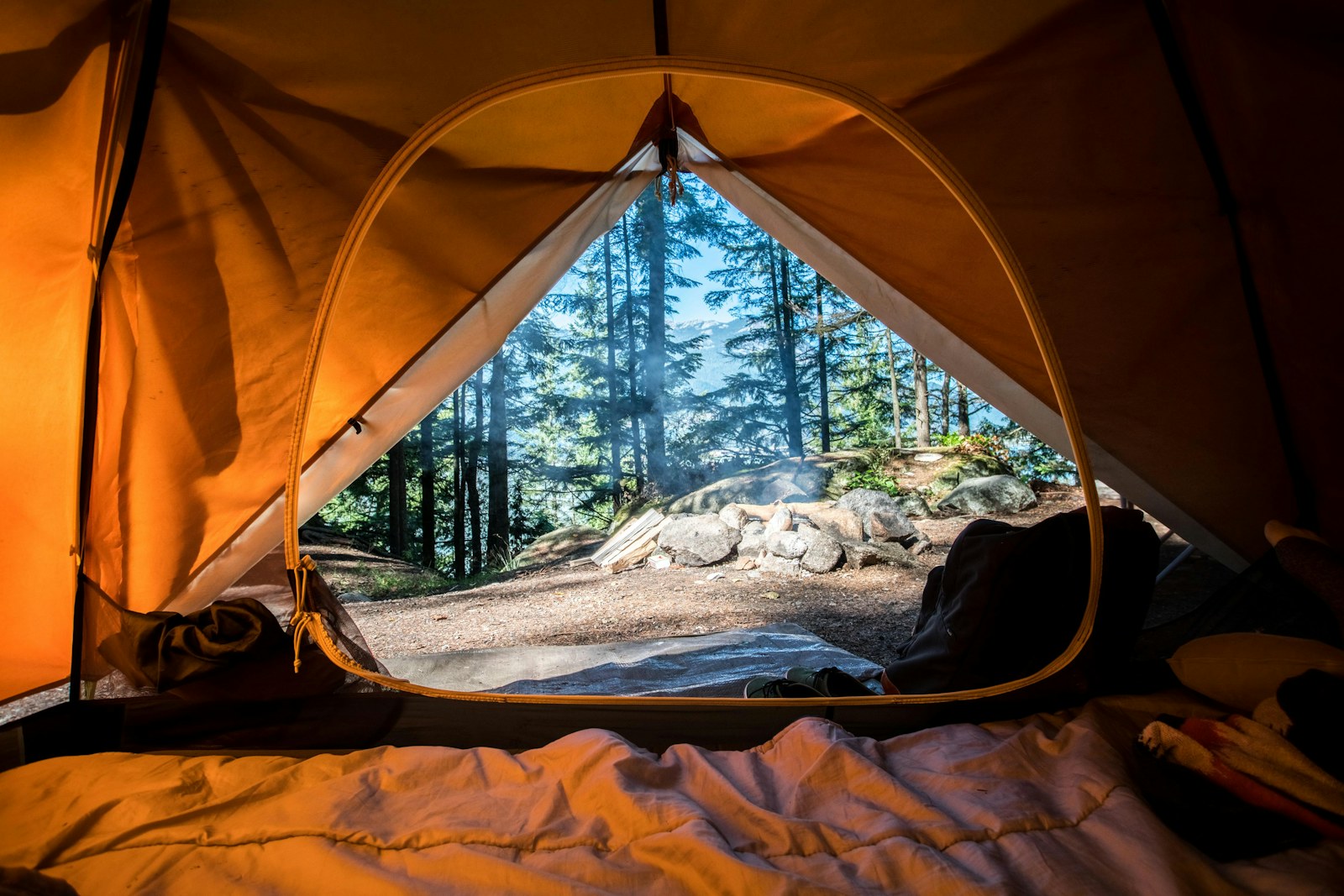 A tent set up at a quiet weekend campsite among trees