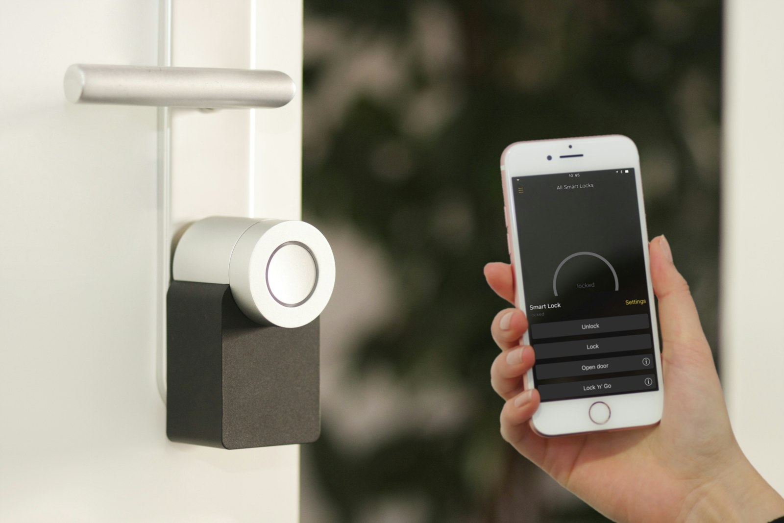 A modern apartment entry with a video doorbell and welcome mat